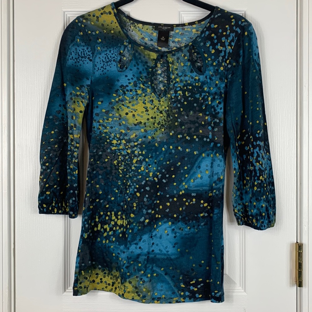 Ann Taylor 3/4 length sleeved top size XS. Blues, green, 3 holes in front.